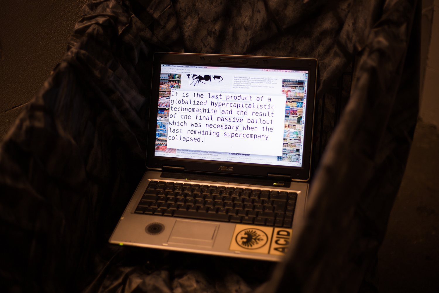 Super Information High Market — video still: 'It is the last product of a globalized hypercapitalistic technomachine'