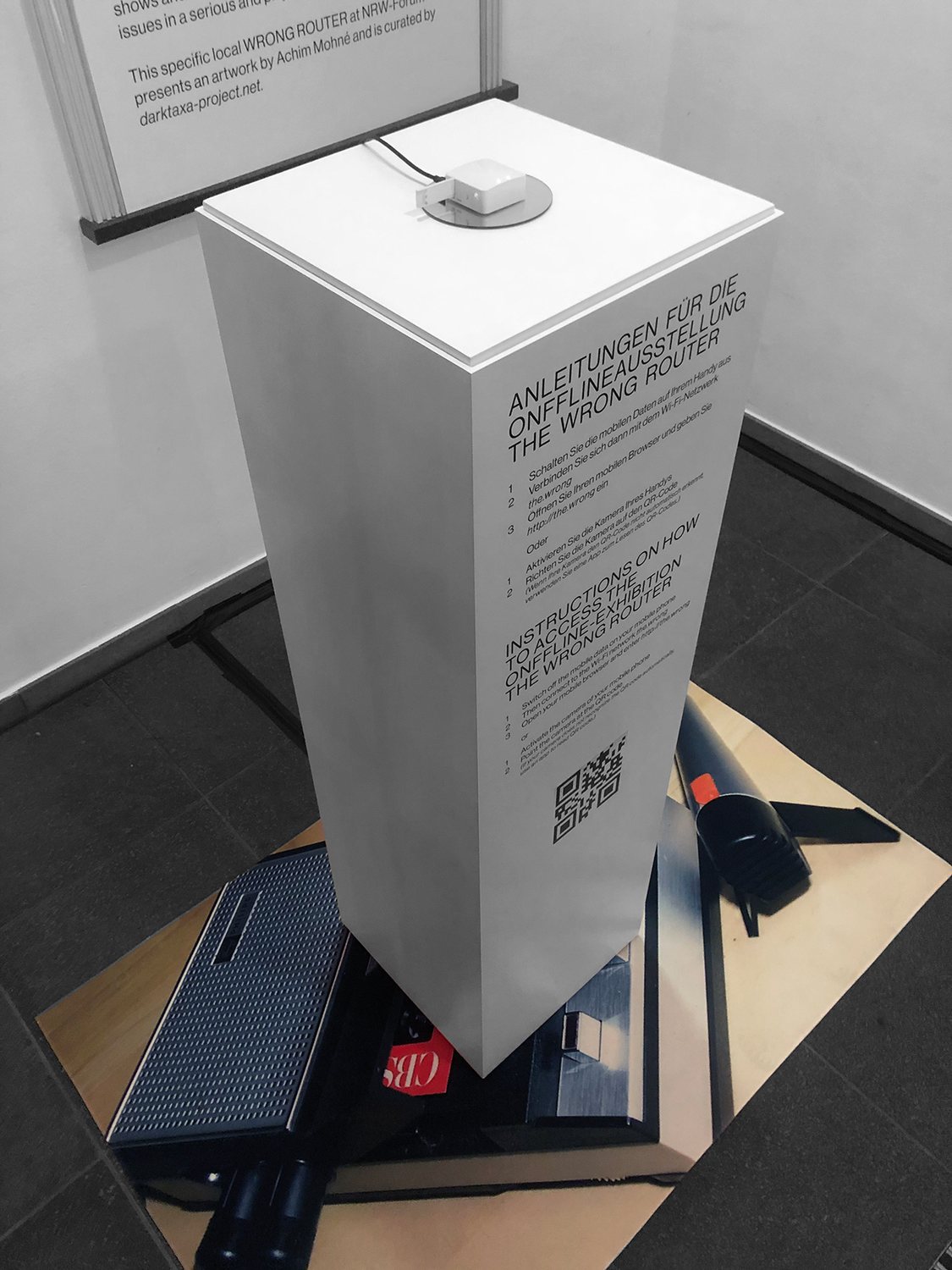 The Wrong Router — the plinth with instruction text and QR code